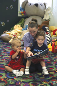 Children being read to at TREASURES child care.